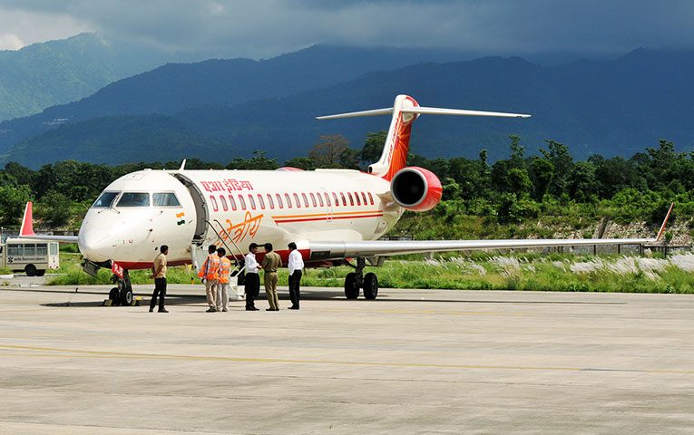 migrant reached uttarakhand by flight