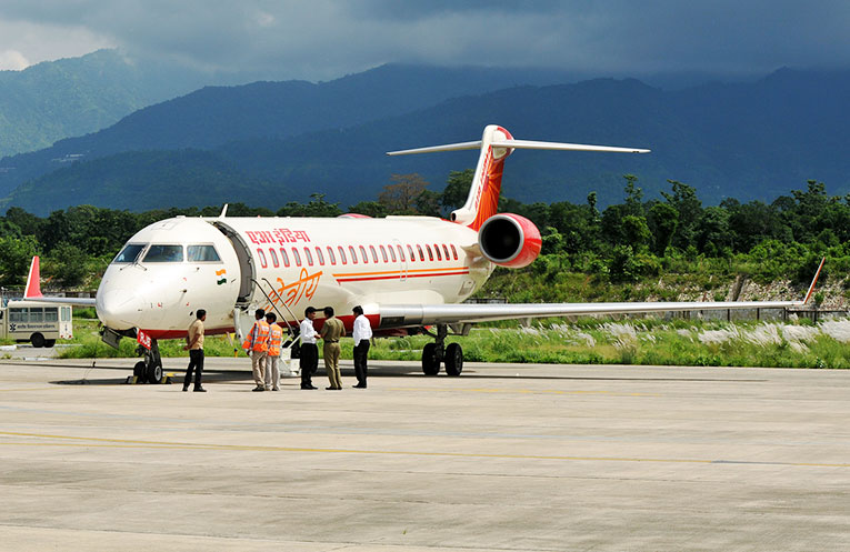 migrant reached uttarakhand by flight